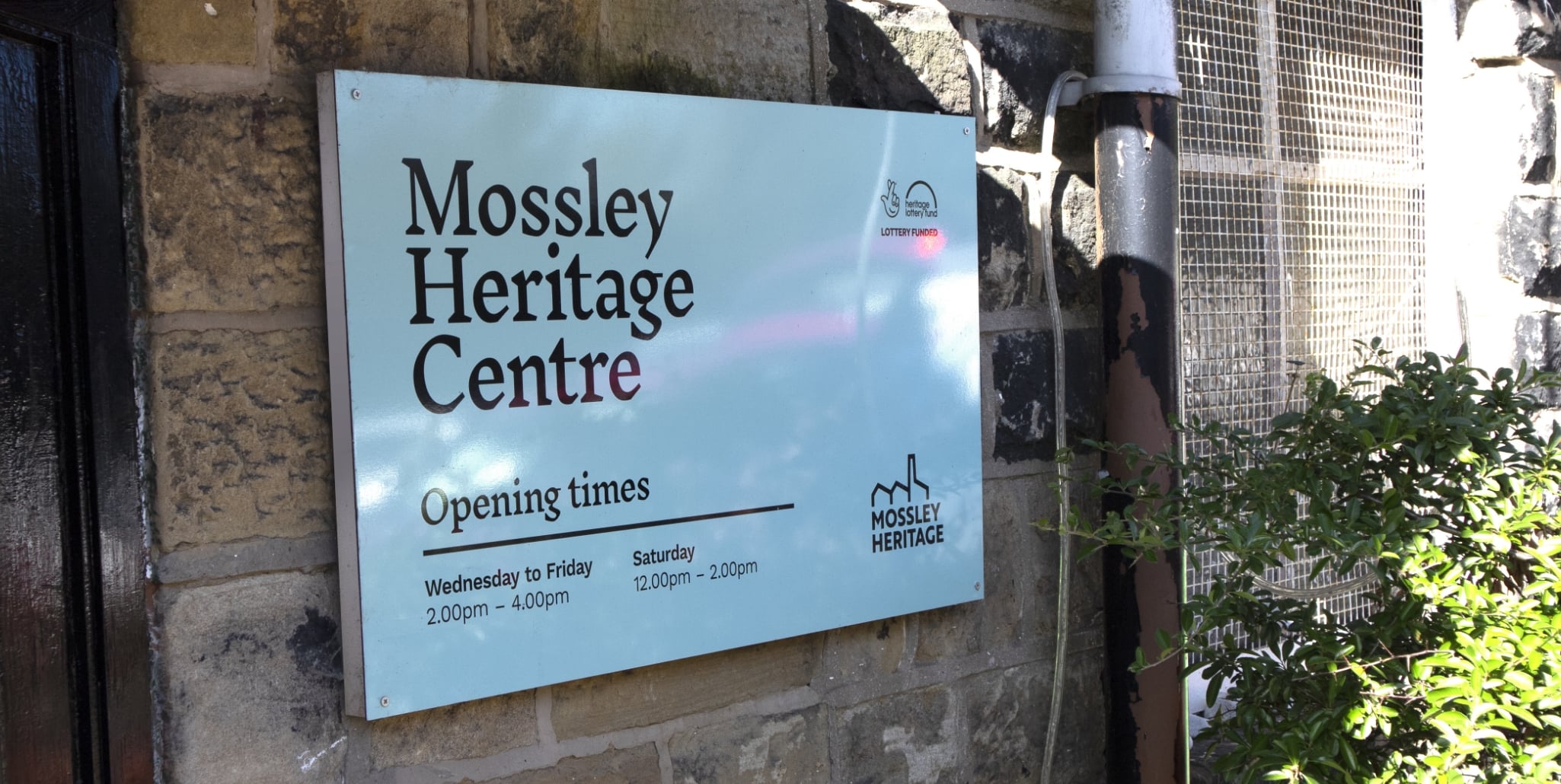 A photograph of the new signage outside Mossley Heritage Centre